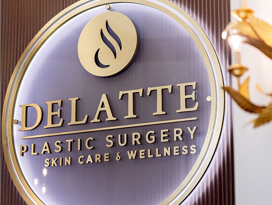 Delatte Plastic Surgery sign with wellness focus