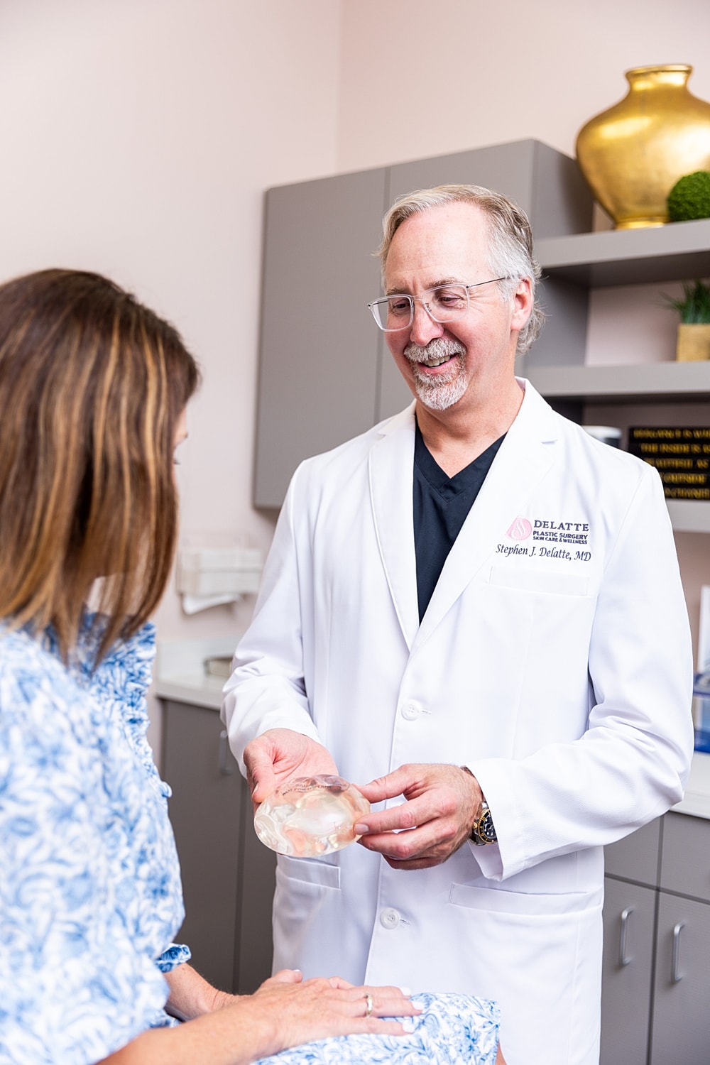 Doctor discussing breast implant options with patient.