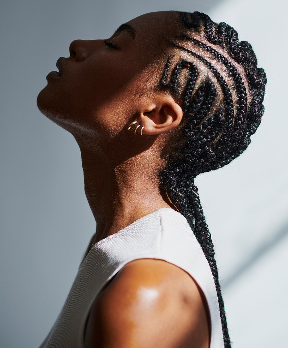 Profile of a person with elegant braided hairstyle.
