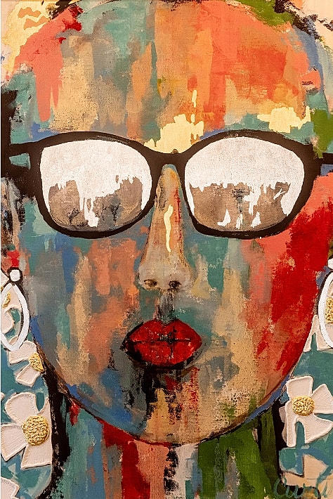 Colorful abstract portrait with glasses and earrings.