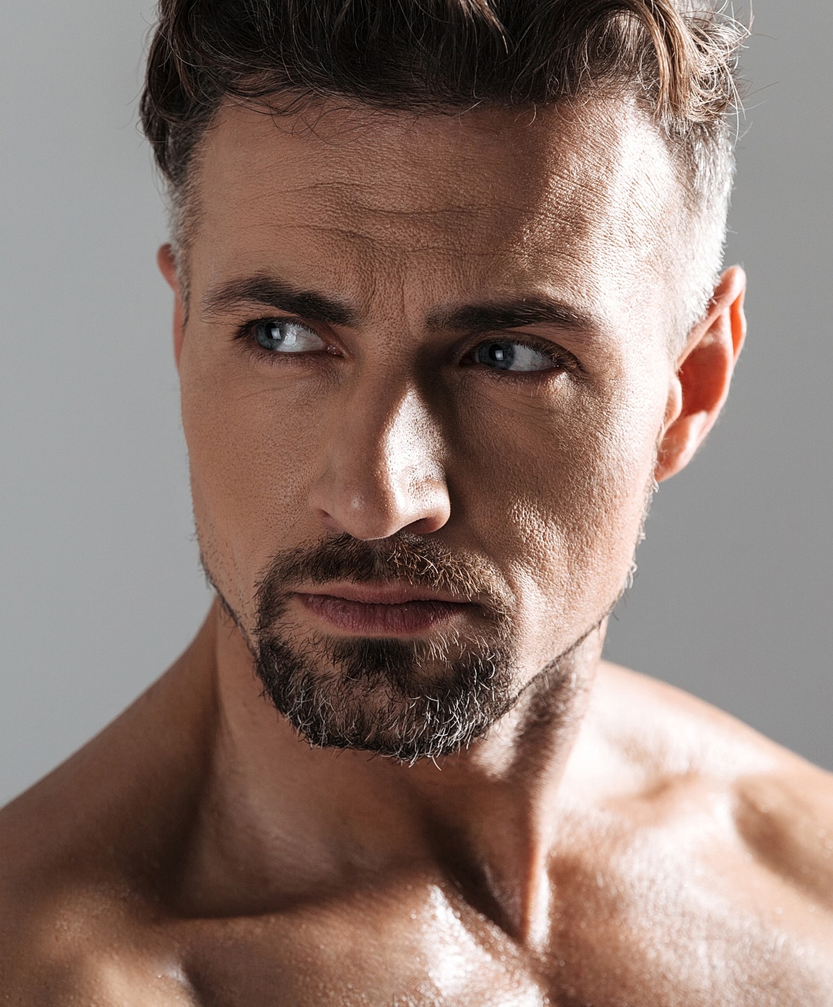 Close-up of a handsome man with facial hair.