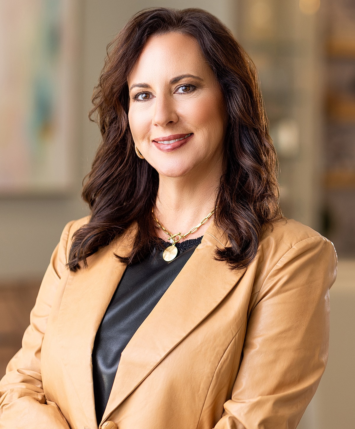 Professional woman standing in an office setting.