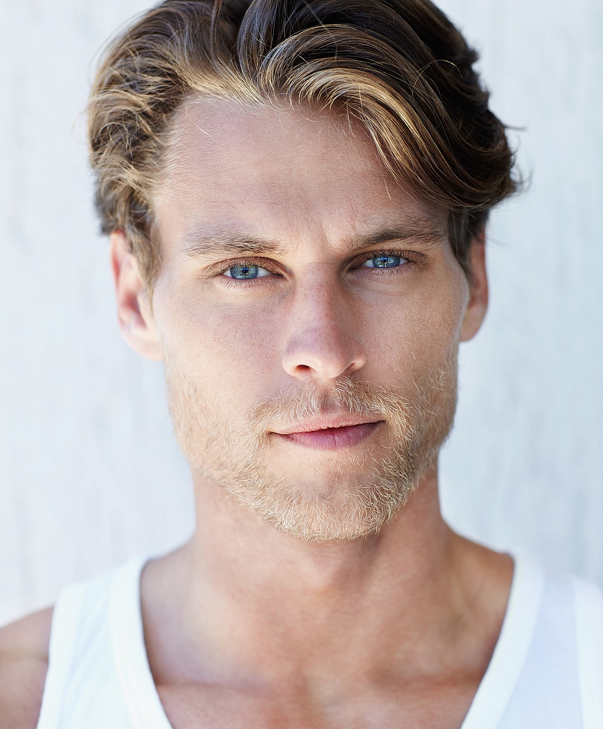 Close-up portrait of a man with blue eyes.