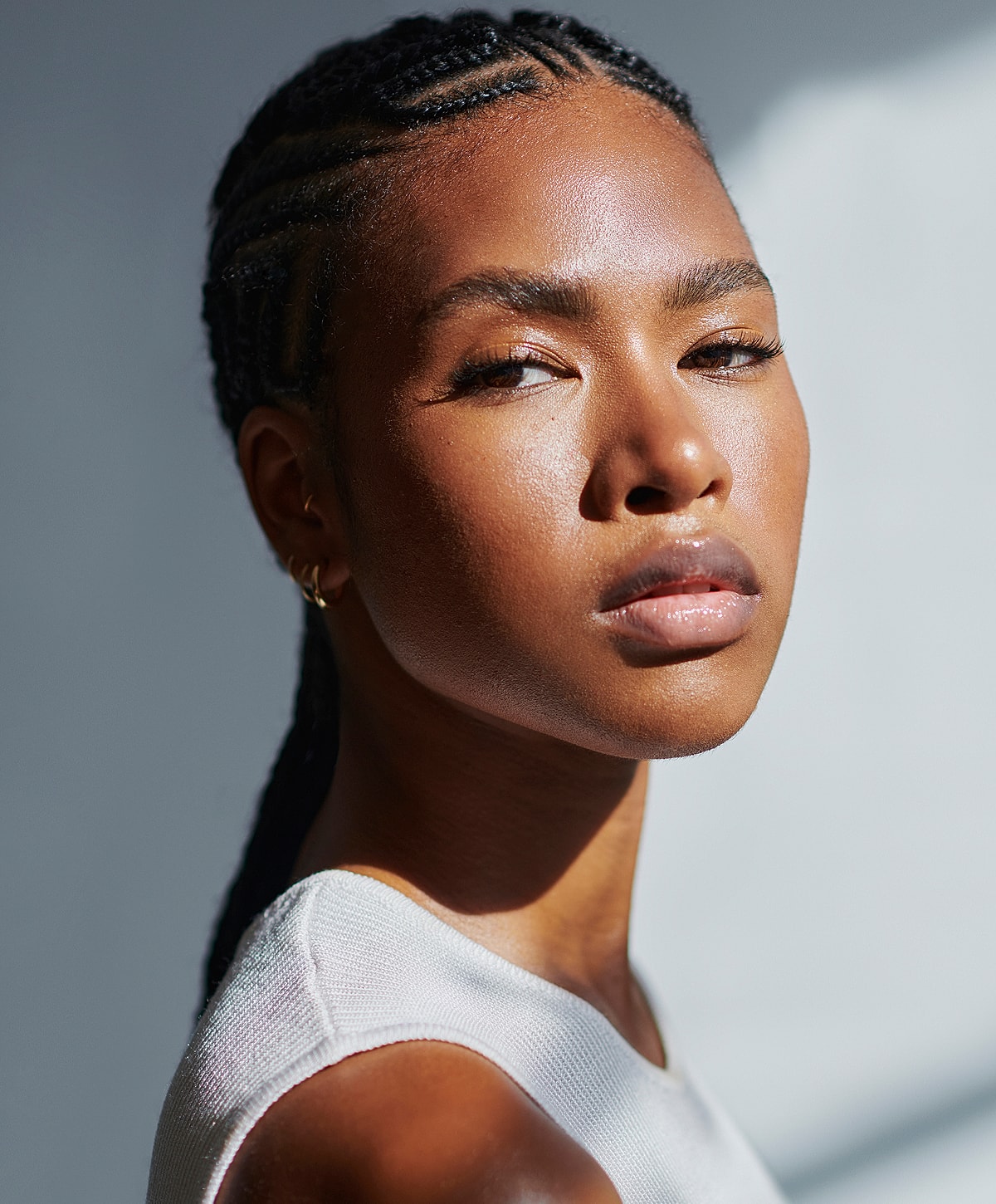 Portrait of a person with braided hair.