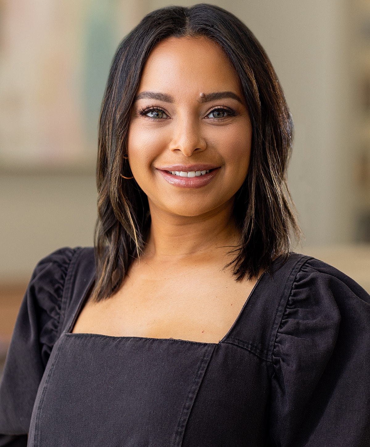 Smiling healthcare professional in scrubs.