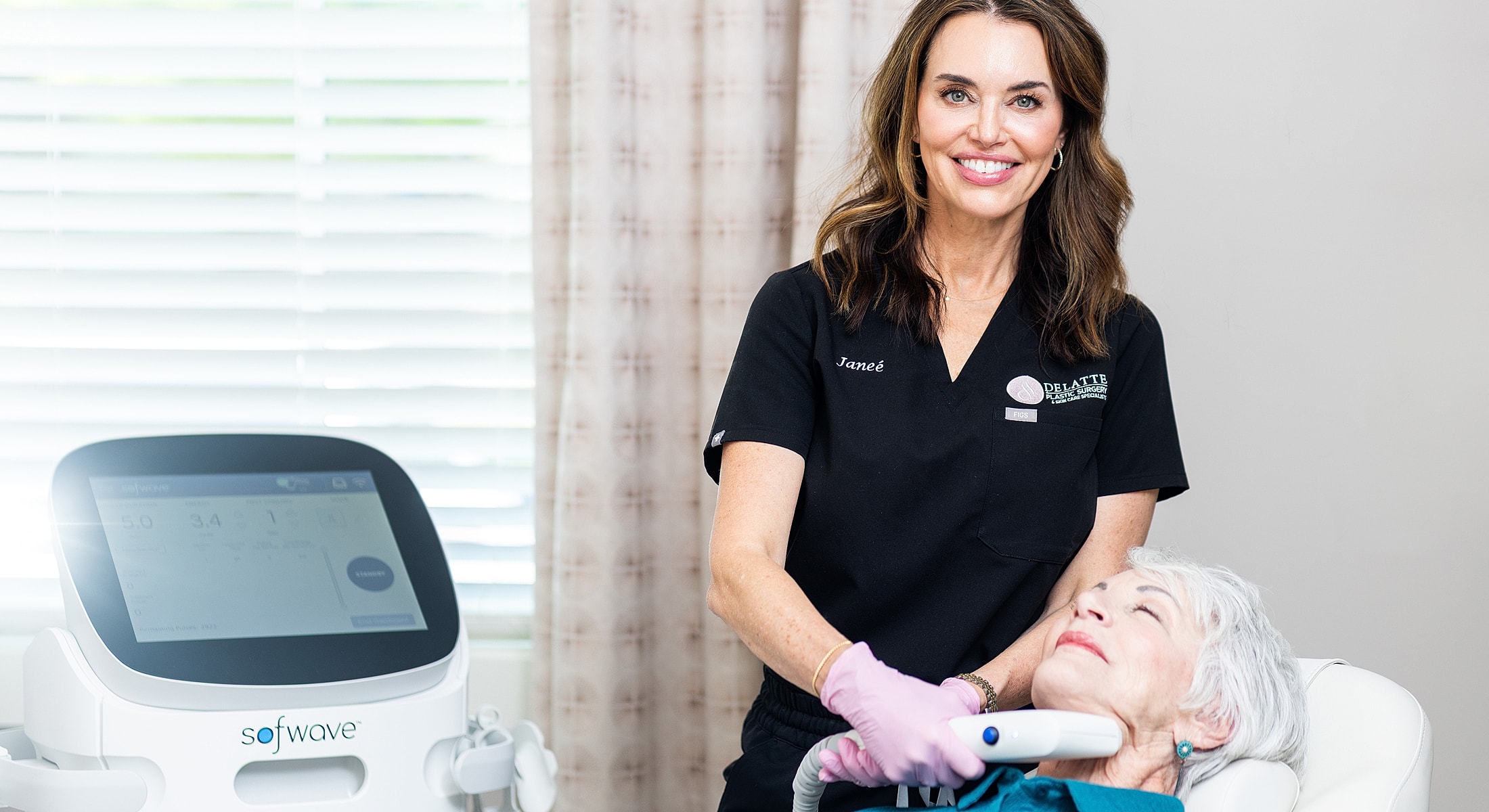 Model in a pink swimsuit sitting gracefully.