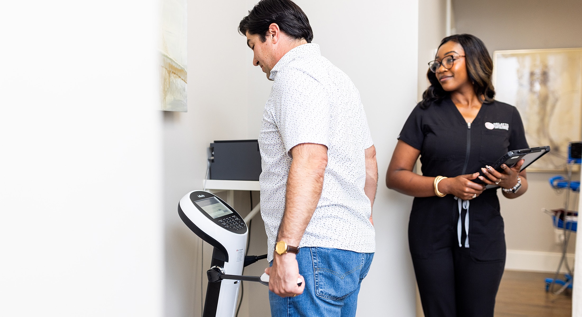 Patient interacting with healthcare professional during assessment.